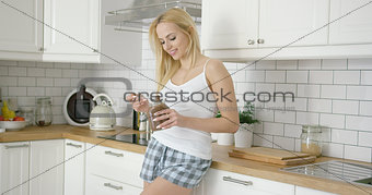 Young woman eating chocolate spread