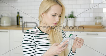 Woman buying in Internet through phone