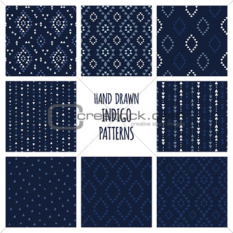 Set of hand drawn indigo blue patterns. Seamless vector navajo backgrounds with triangles, arrows, rhombuses and diamonds.
