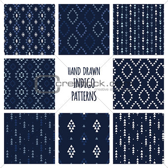 Set of hand drawn indigo blue patterns. Seamless vector tribal indian backgrounds with triangles, arrows, rhombuses and diamonds.