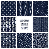 Set of hand drawn indigo blue and white patterns. Seamless vector triblal aztec backgrounds with triangles and arrows.