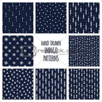 Set of hand drawn indigo blue patterns. Seamless vector native american backgrounds with triangles and arrows.