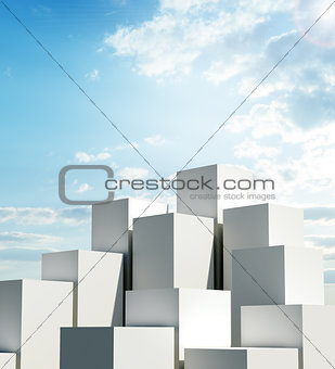 A group of tall cubes against a blue sky