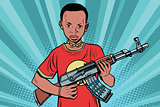 African boy with AKM automatic weapons