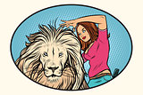 Female stylist hairdresser cuts the mane of a lion