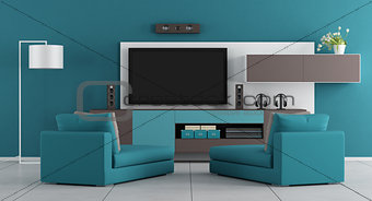 Blue living room with tv