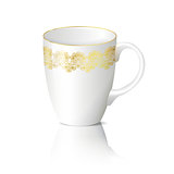 white cup with gold ornaments with reflection