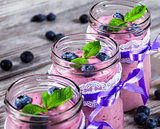 yogurt with blueberries and mint, close-up, selective focus