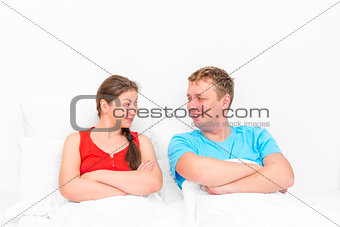 loving couple looking at each other in bed