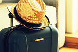 Traveling background. Suitcase and tourist stuff ready for travel