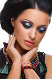 Beautiful girl with bright vivid purple and green make-up