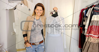 Tailor posing with mannequin