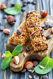 Candied cereal bars with nuts and chocolate.