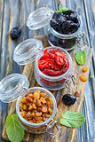 Dried fruit in glass jars.