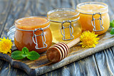 Buckwheat, linden and flower honey in glass jars.