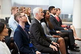 Audience Listening To  Speaker At Conference Presentation