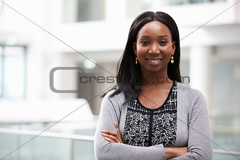 Head And Shoulders Portrait Of Businesswoman In Office
