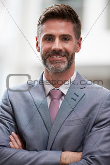 Head And Shoulders Portrait Of Businessman In Office