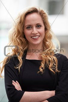 Head And Shoulders Portrait Of Businesswoman In Office