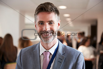 Portrait Of Male Delegate During Break At Conference