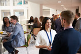 Delegates Networking During Coffee Break At Conference
