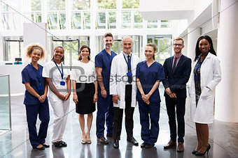 Portrait Of Medical Staff Standing In Lobby Of Hospital
