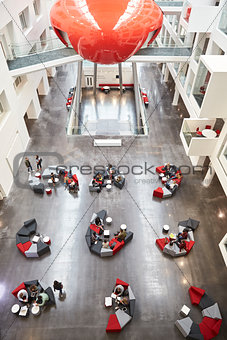 Seating in the atrium of modern university building, vertical