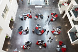 Overhead view of seating in a university atrium, motion blur