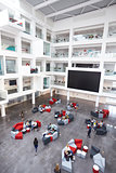 Modern university lobby atrium and study rooms, vertical