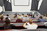 Lecture at university lecture theatre, audience POV