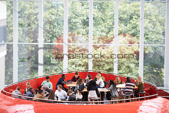 Students hanging out in university mezzanine social area