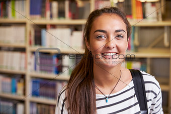 Portrait Of Female University Student Working In Library
