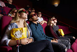Young Couple In Cinema Wearing 3D Glasses Watching Film