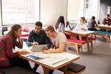 Group Of University Students Working In Study Room