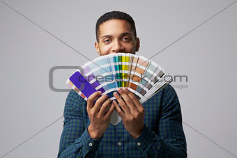 Studio Portrait Of Graphic Designer With Color Swatches