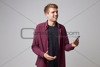 Studio Portrait Of Male Journalist With Digital Recorder