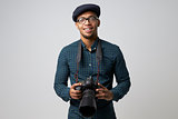 Studio Portrait Of Male Photographer With Camera