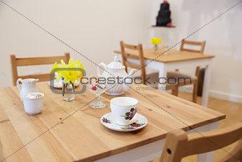 Interior Of Empty Tea Shop With Tables And Crockery