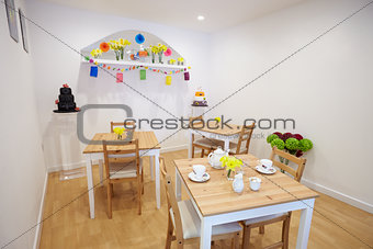 Interior Of Empty Tea Shop With Tables And Crockery