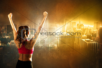 Athletic woman on city background