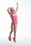 Little girl in a pink swimsuit