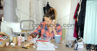 Female tailor in process of working