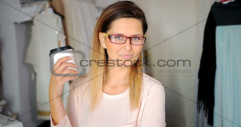 Young smiling girl with coffee