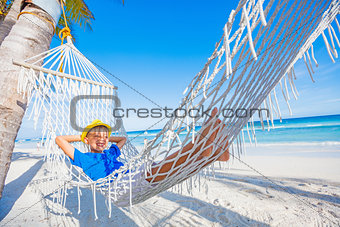 Boy relaxing on a beach.