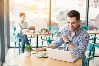 Young stylish man in cafe