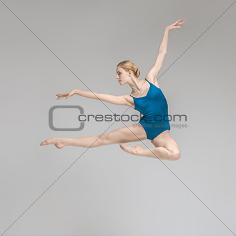 Ballerina posing in jump