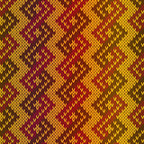 Knitting seamless pattern mainly in red and orange hues