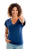 Happy mature woman pointing