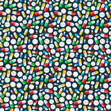 Colourful pills on dark background, seamless pattern