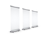 Three blank realistic roll-up banners with shadow in perspective view on white